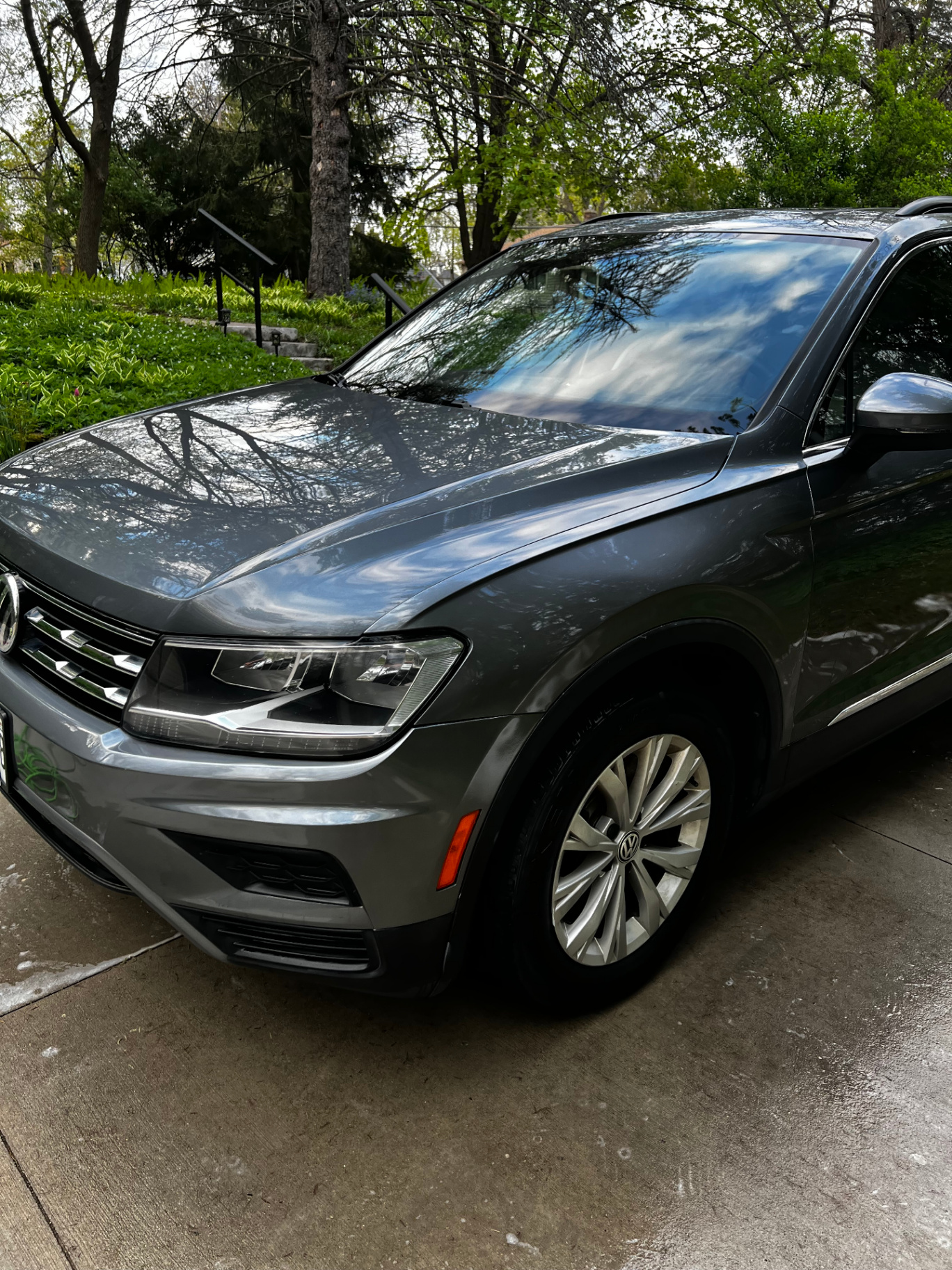 Freshly washed grey Volkswagen Tiguan with a glossy finish