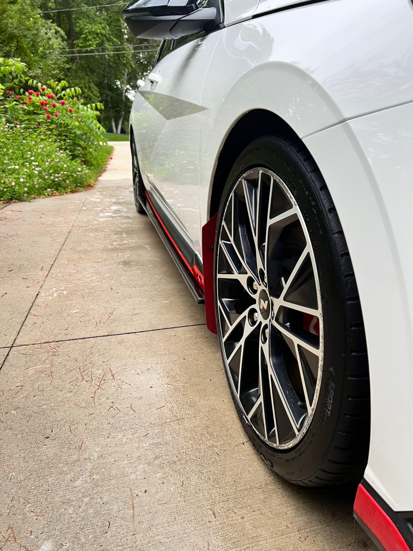 White Hyundai Elantra N with detailed wheel and tire shine