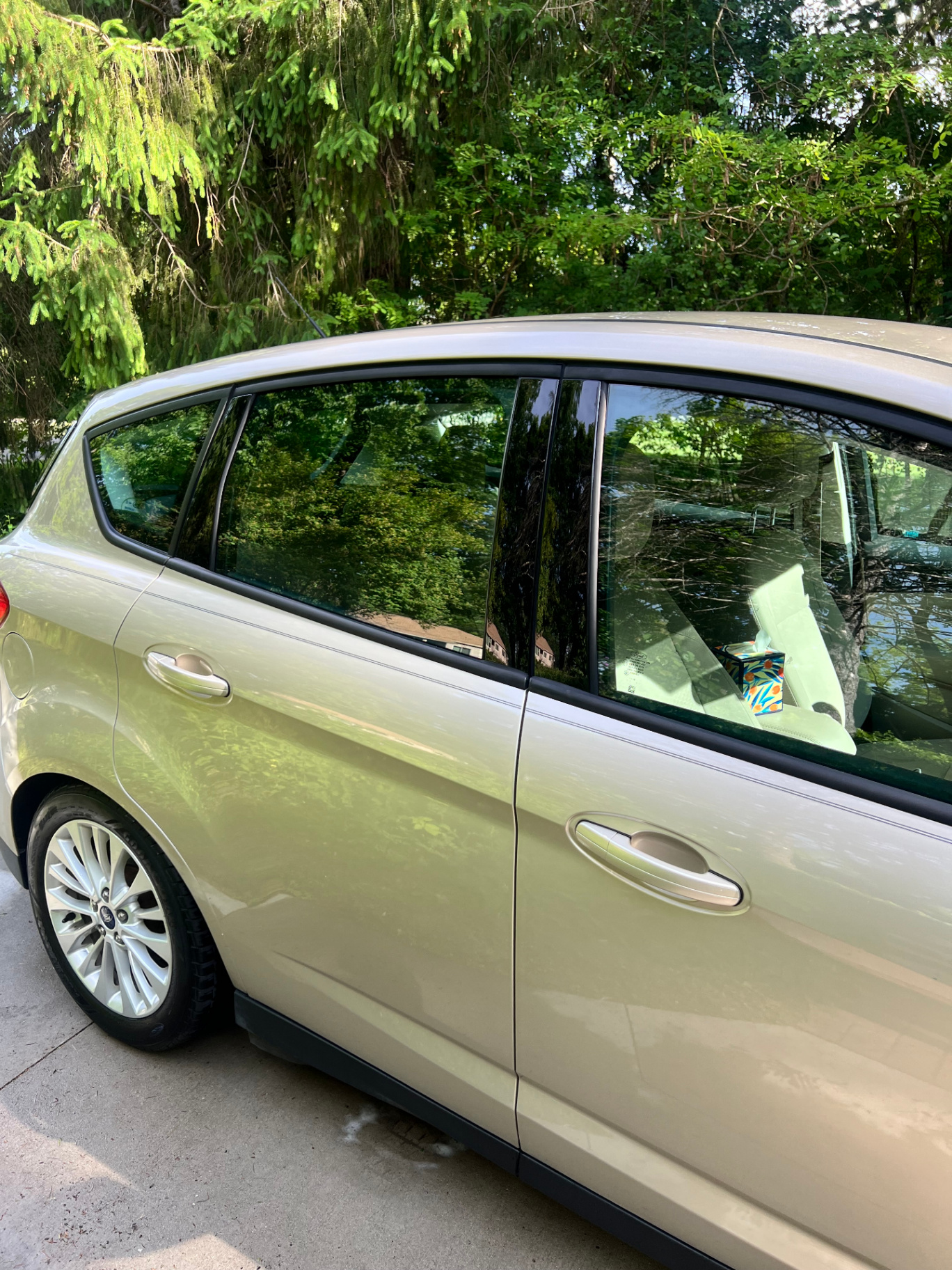 Clean gold Ford C-Max exterior with spotless windows and paint